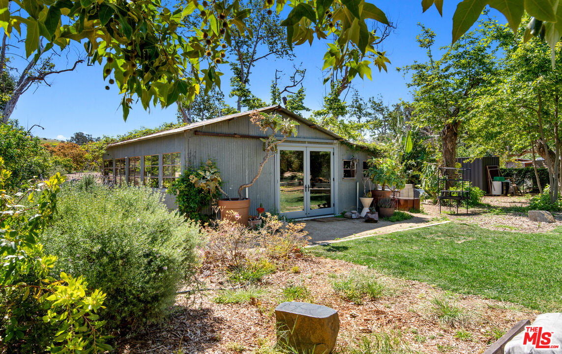 6009 Bonsall Drive Malibu, CA 90265 - Photo 39 of 49 a front view of a house with garden