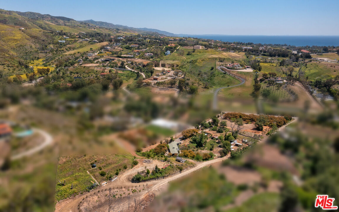 6009 Bonsall Drive Malibu, CA 90265 - Photo 4 of 49 an aerial view of a houses with a lake view