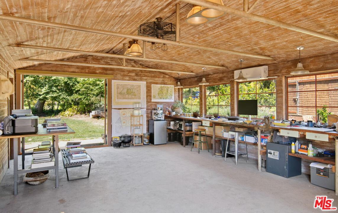 6009 Bonsall Drive Malibu, CA 90265 - Photo 41 of 49 a room with lots of furniture and windows