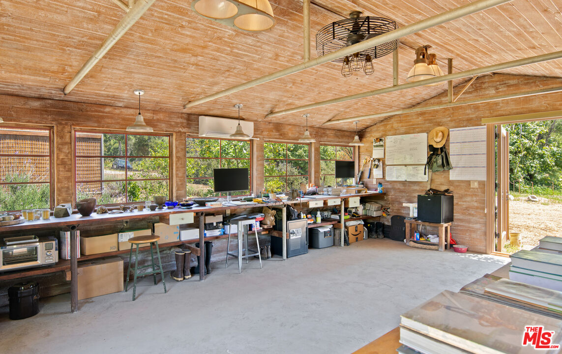 6009 Bonsall Drive Malibu, CA 90265 - Photo 43 of 49 a group of people sitting in a living room