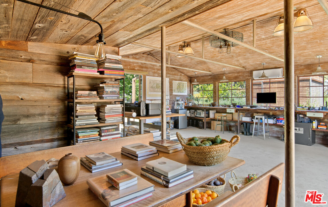 6009 Bonsall Drive Malibu, CA 90265 - Photo 44 of 49 a view of a patio with dining table and chairs