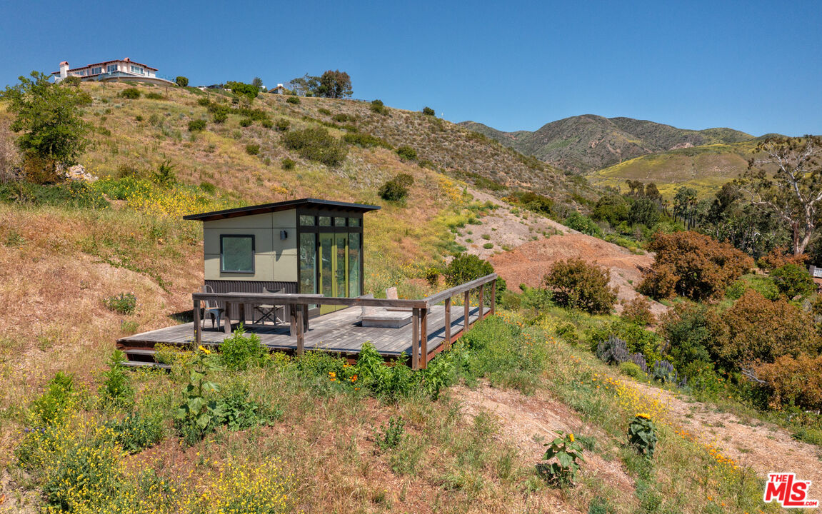 6009 Bonsall Drive Malibu, CA 90265 - Photo 49 of 49 a view of a house with a yard and sitting area