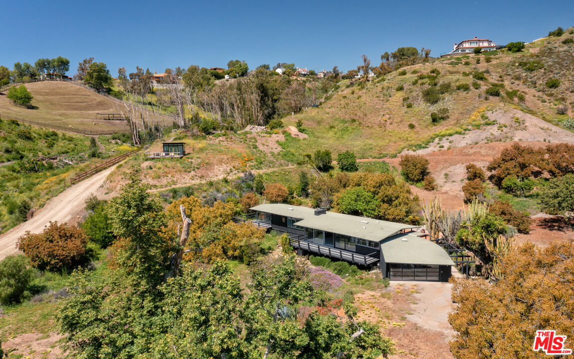 6009 Bonsall Drive Malibu, CA 90265 - Photo 5 of 49 an aerial view of a house with a yard and mountain view in back