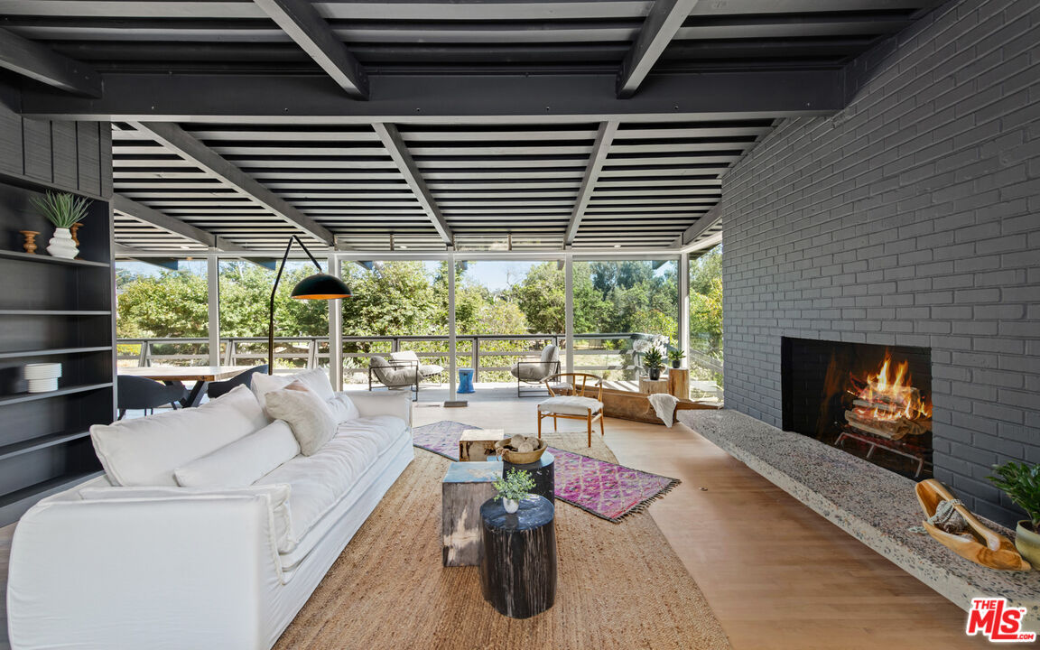 6009 Bonsall Drive Malibu, CA 90265 - Photo 6 of 49 a living room with furniture and a fireplace
