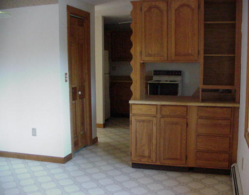 32 Sandy Cove Road Lunenburg, MA 01462 - Photo 5 of 5 a kitchen with cabinets and a stove top oven
