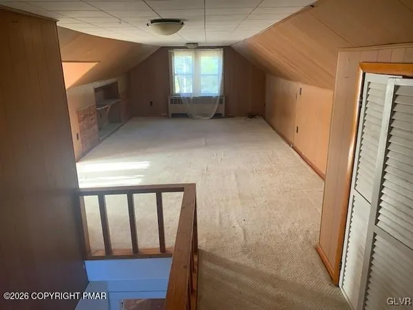 a view of entryway with stairs and wooden floor