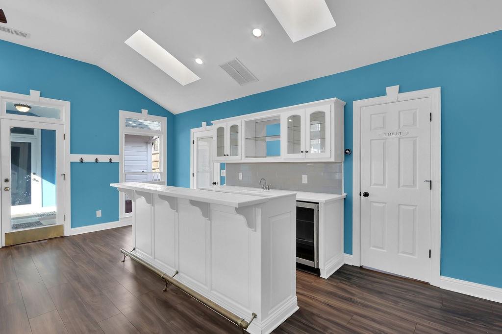 326 Fayette Drive Winder, GA 30680 - Photo 12 of 57 a kitchen with stainless steel appliances a white stove top oven a sink dishwasher and a refrigerator with wooden floor