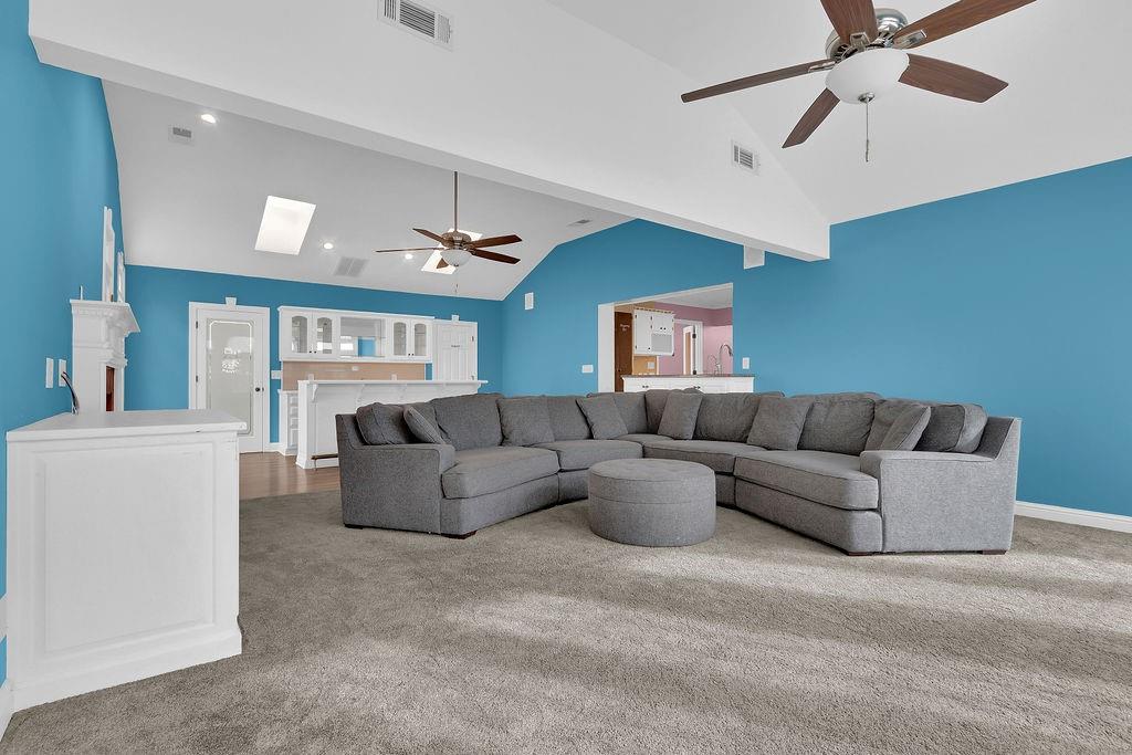 326 Fayette Drive Winder, GA 30680 - Photo 15 of 57 a living room with furniture a ceiling fan and a window