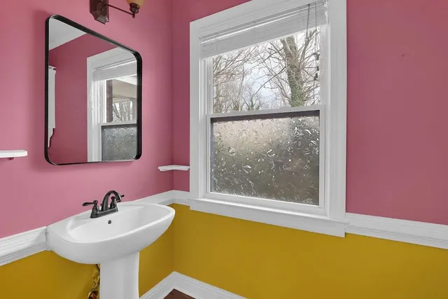 a bathroom with a sink and a mirror