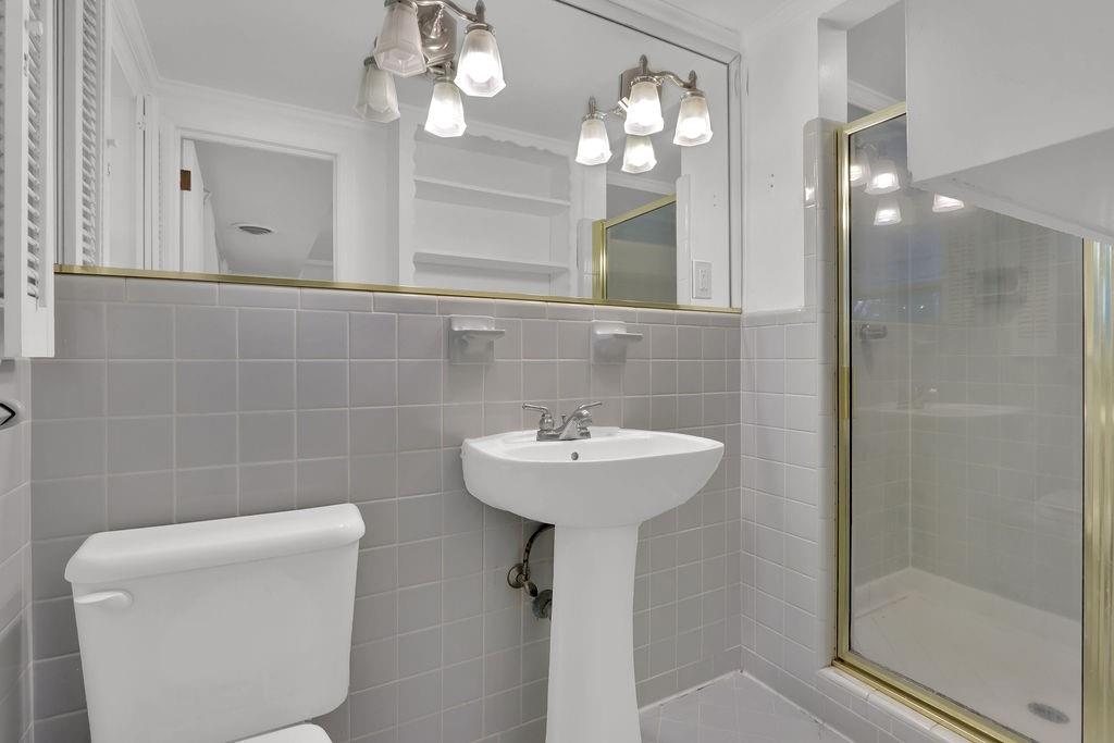 326 Fayette Drive Winder, GA 30680 - Photo 26 of 57 a bathroom with a sink a light fixture and a mirror