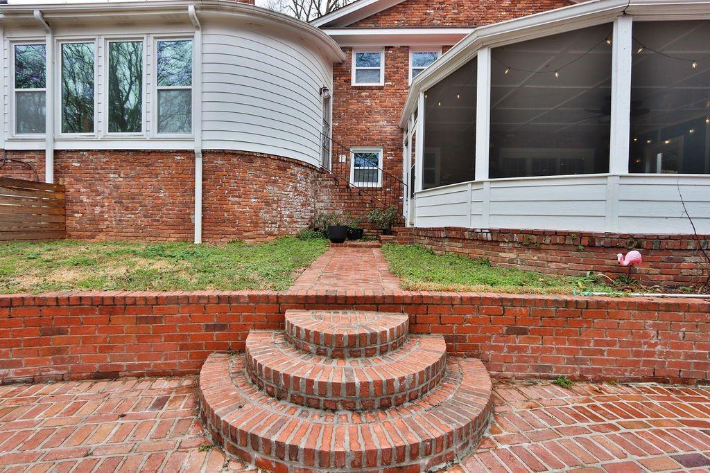 326 Fayette Drive Winder, GA 30680 - Photo 45 of 57 a view of a house with a small yard and a fountain