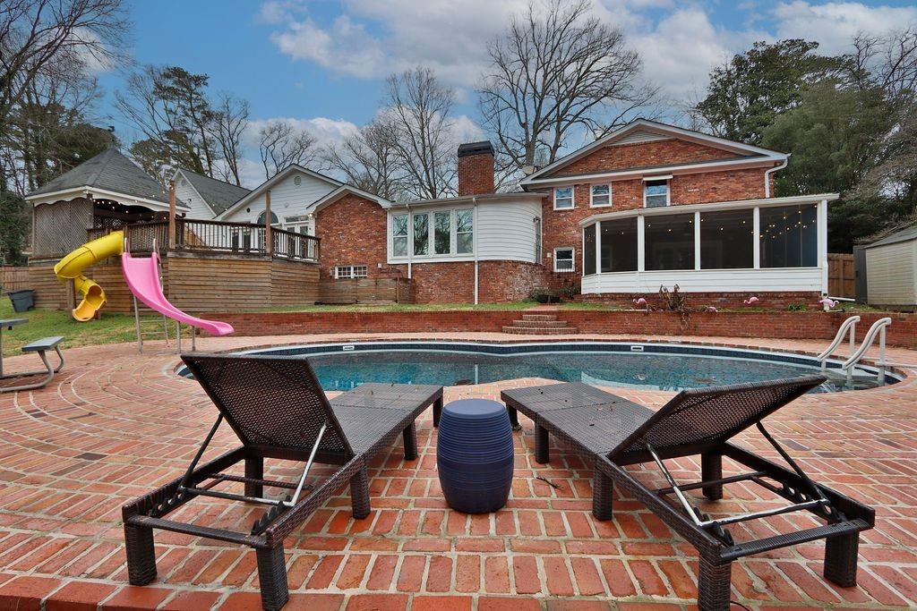 326 Fayette Drive Winder, GA 30680 - Photo 46 of 57 a backyard of a house with barbeque oven table and chairs