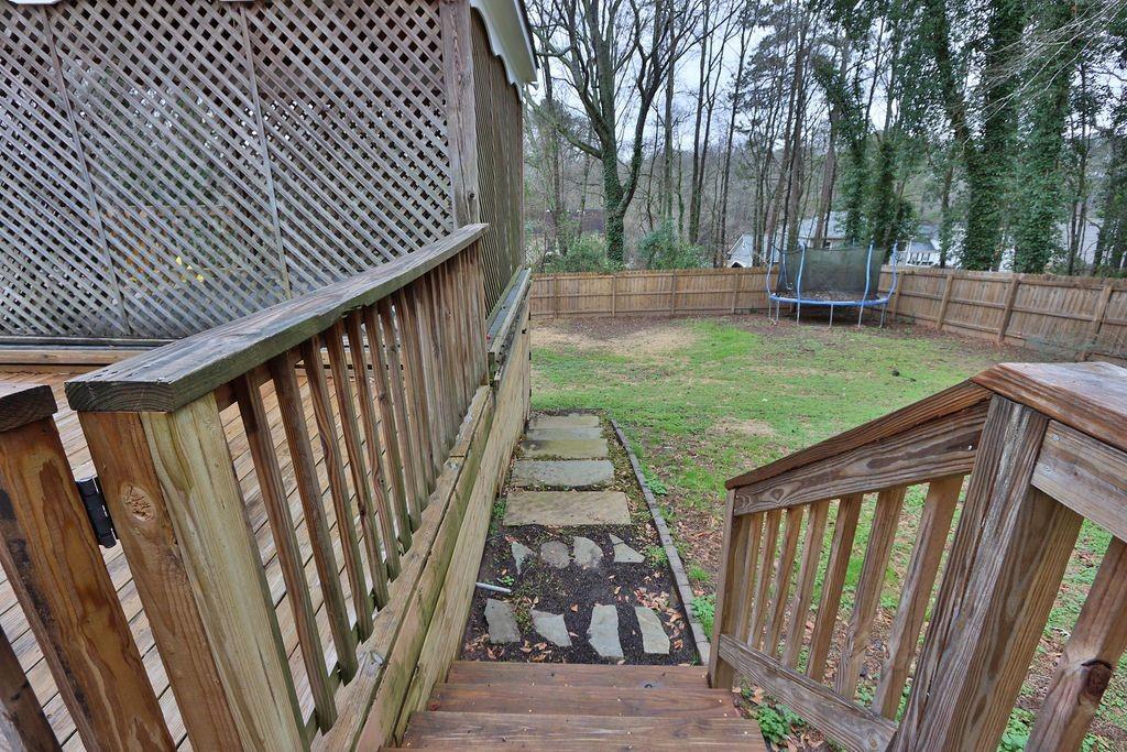 326 Fayette Drive Winder, GA 30680 - Photo 50 of 57 a view of backyard with deck and wooden fence