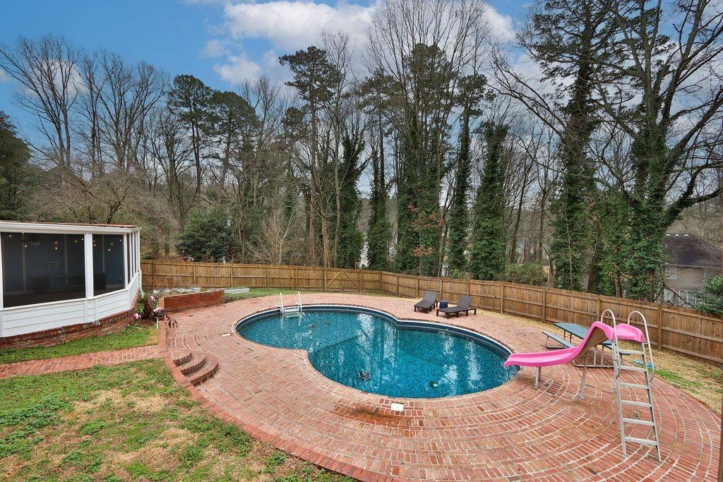 326 Fayette Drive Winder, GA 30680 - Photo 52 of 57 a view of swimming pool with seating space