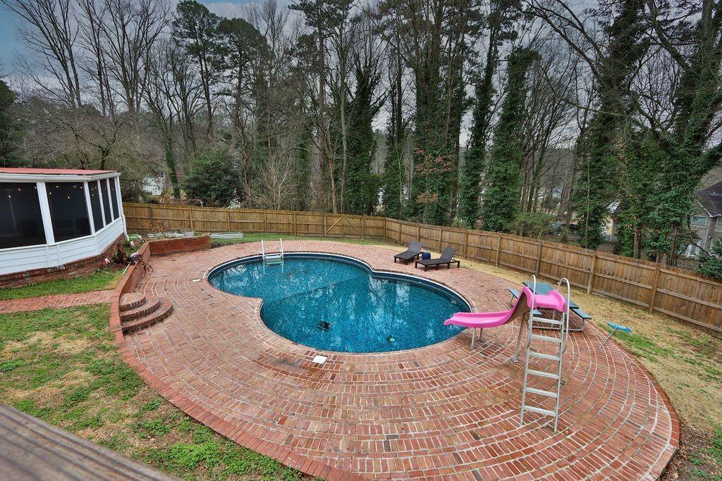 326 Fayette Drive Winder, GA 30680 - Photo 54 of 57 a view of a swimming pool with a yard