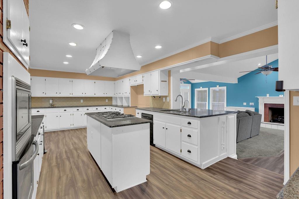 326 Fayette Drive Winder, GA 30680 - Photo 10 of 57 a kitchen with granite countertop a stove and a sink