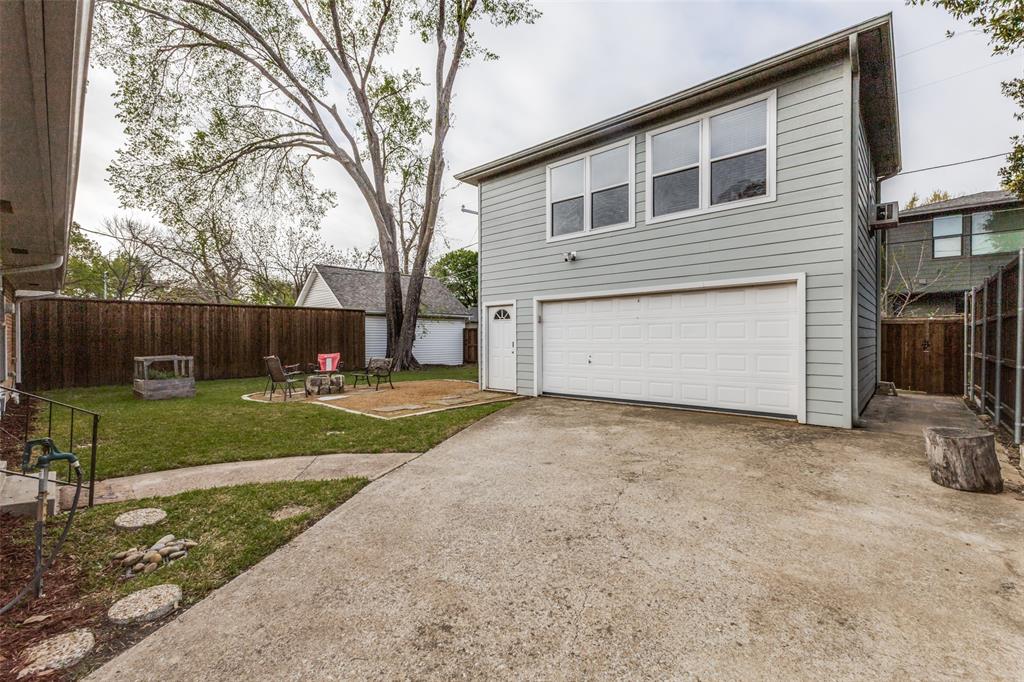 7128 Haverford Road Dallas, TX 75214 - Photo 17 of 24 a view of a house with a yard and a large tree