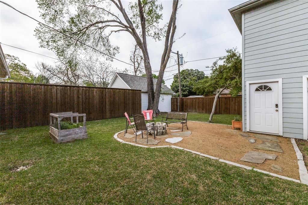 7128 Haverford Road Dallas, TX 75214 - Photo 18 of 24 a view of a backyard with furniture and a fire pit