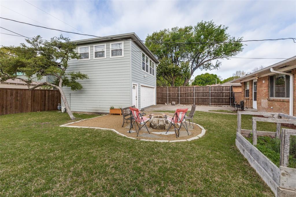 7128 Haverford Road Dallas, TX 75214 - Photo 19 of 24 a view of a chair and table in backyard of the house