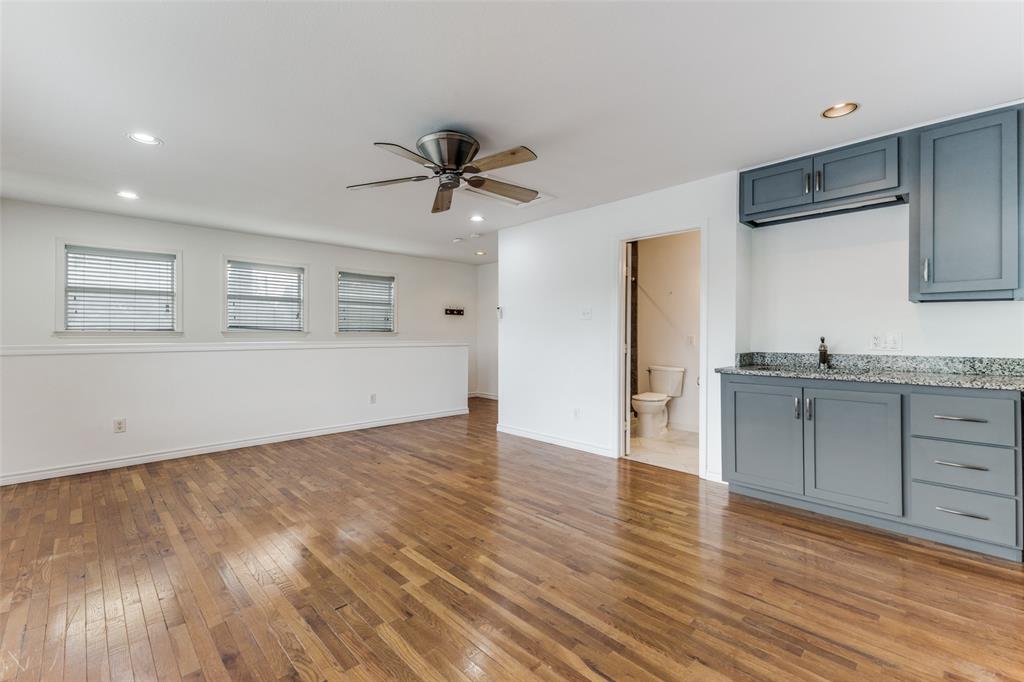 7128 Haverford Road Dallas, TX 75214 - Photo 23 of 24 a view of a kitchen with microwave and stove