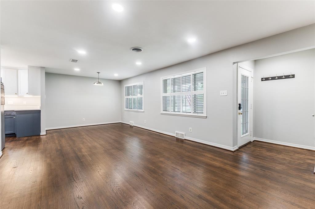 7128 Haverford Road Dallas, TX 75214 - Photo 4 of 24 a view of empty room with wooden floor and fan