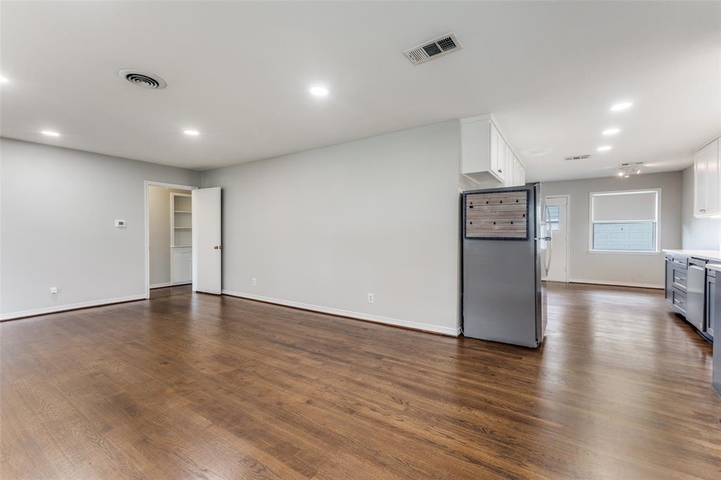 7128 Haverford Road Dallas, TX 75214 - Photo 5 of 24 a view of empty room with wooden floor
