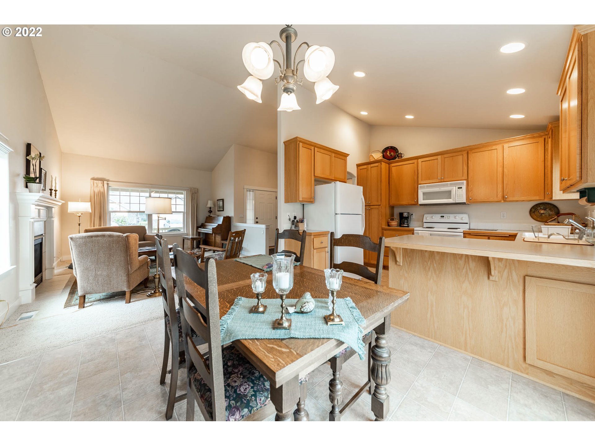4019 Douglas Drive Springfield, OR 97478 - Photo 13 of 32 a view of a dining room with furniture and chandelier