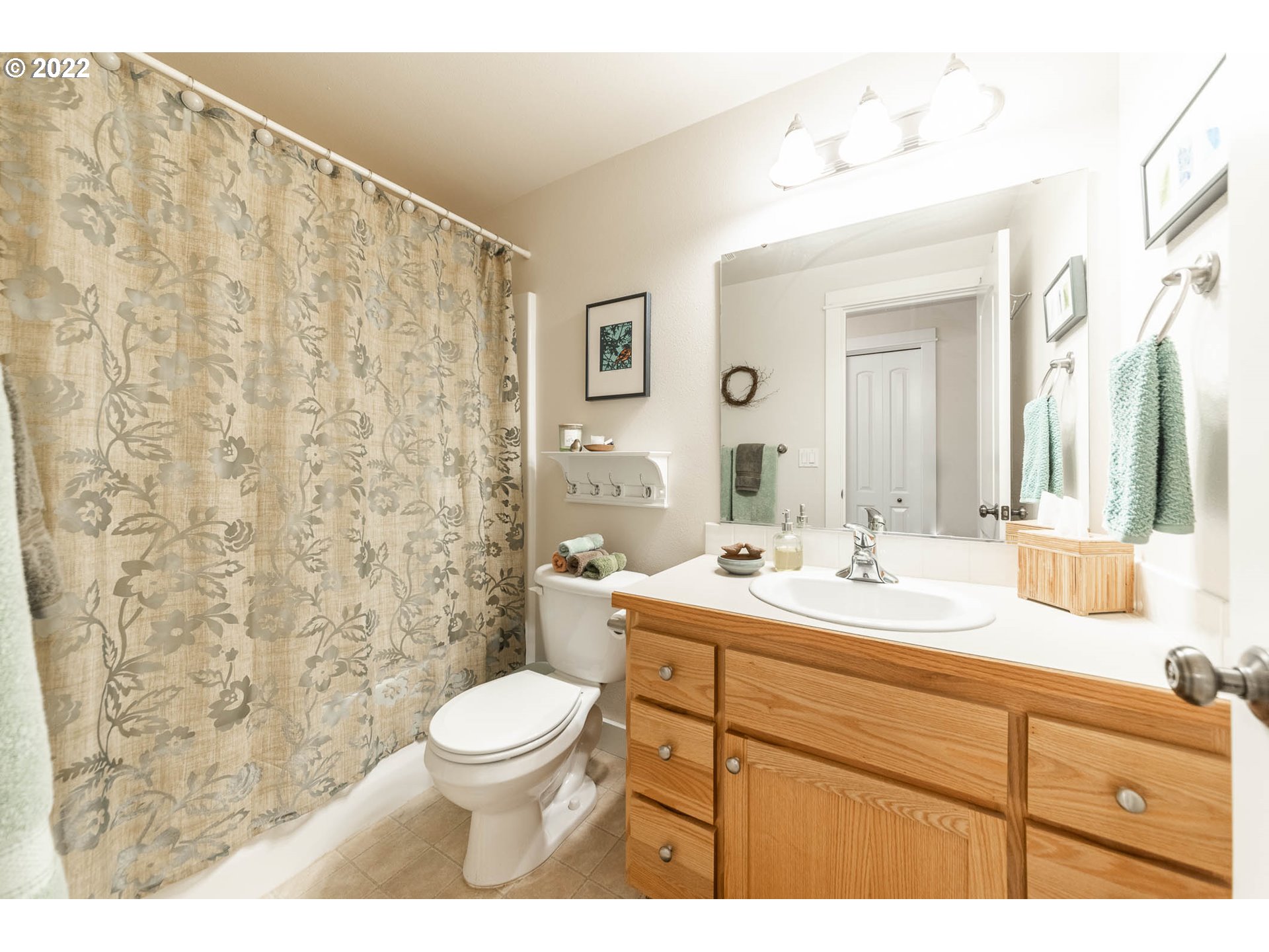 4019 Douglas Drive Springfield, OR 97478 - Photo 17 of 32 a bathroom with a double vanity sink toilet and a mirror