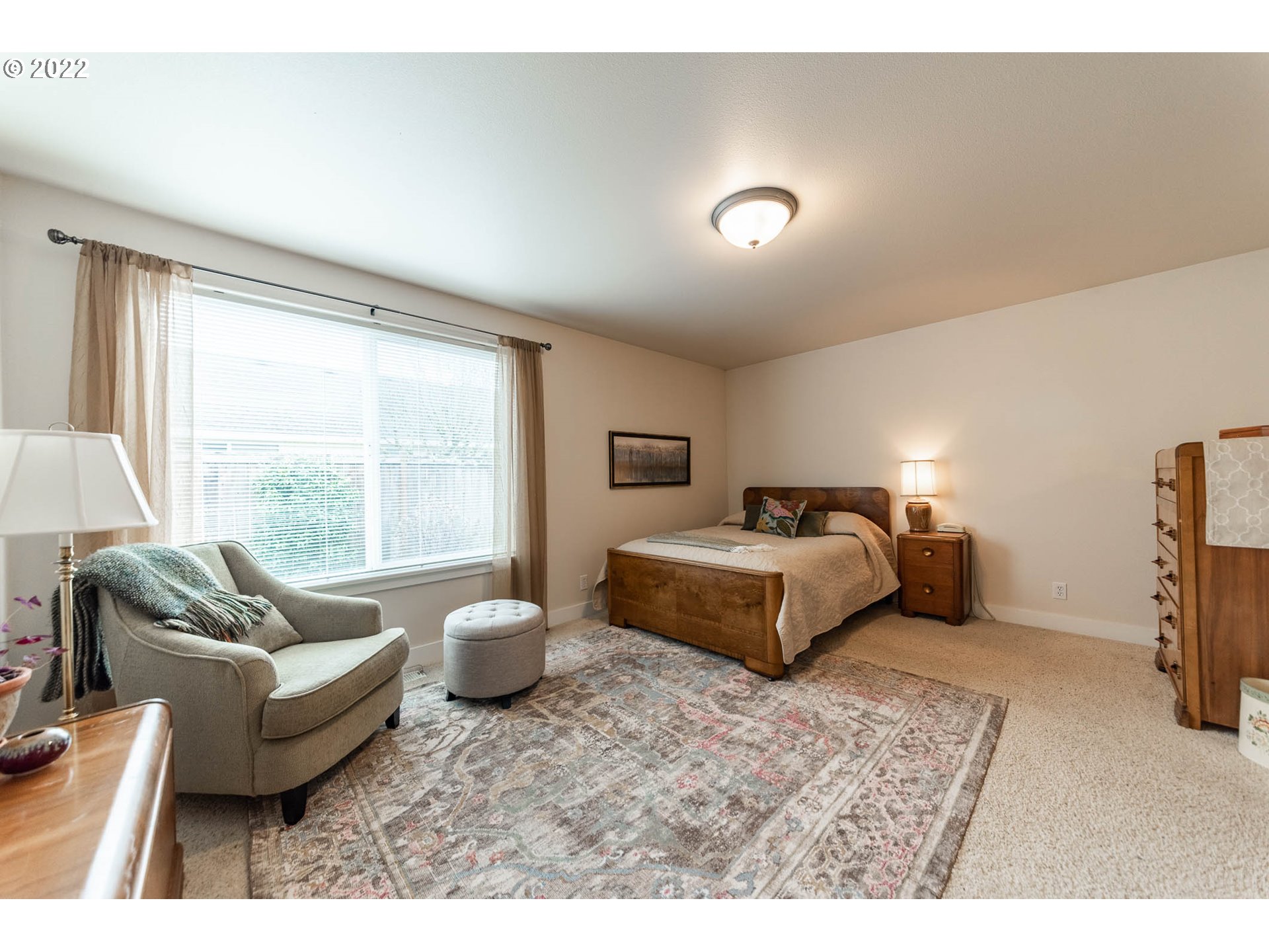 4019 Douglas Drive Springfield, OR 97478 - Photo 21 of 32 a spacious bedroom with a bed and glass window