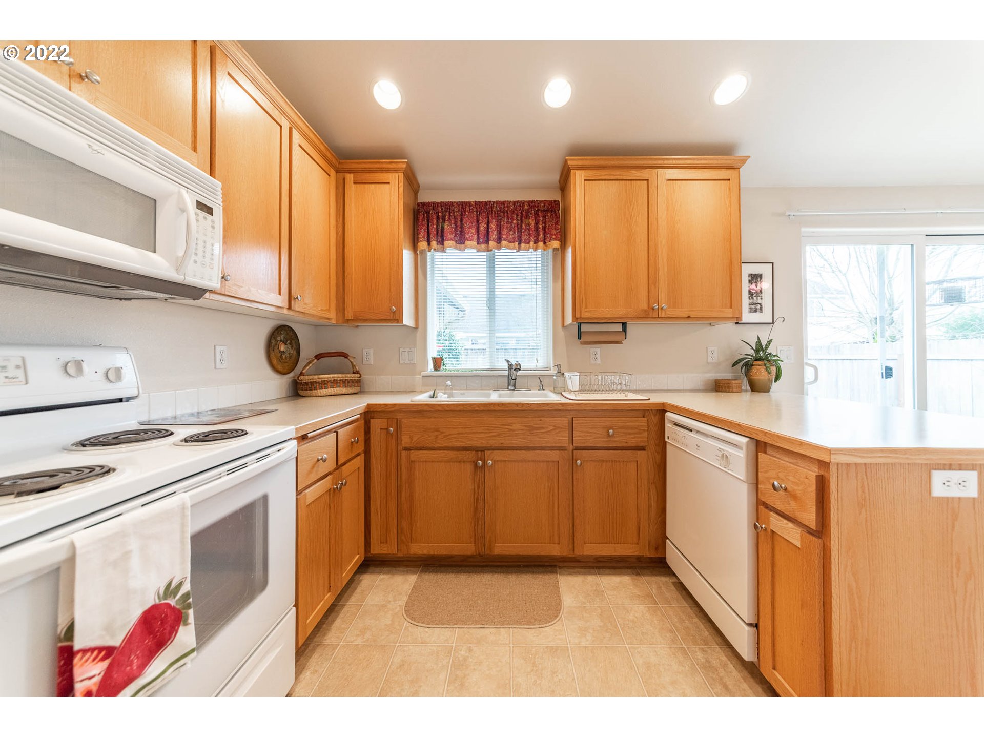 4019 Douglas Drive Springfield, OR 97478 - Photo 9 of 32 a kitchen with stainless steel appliances granite countertop a sink stove and cabinets