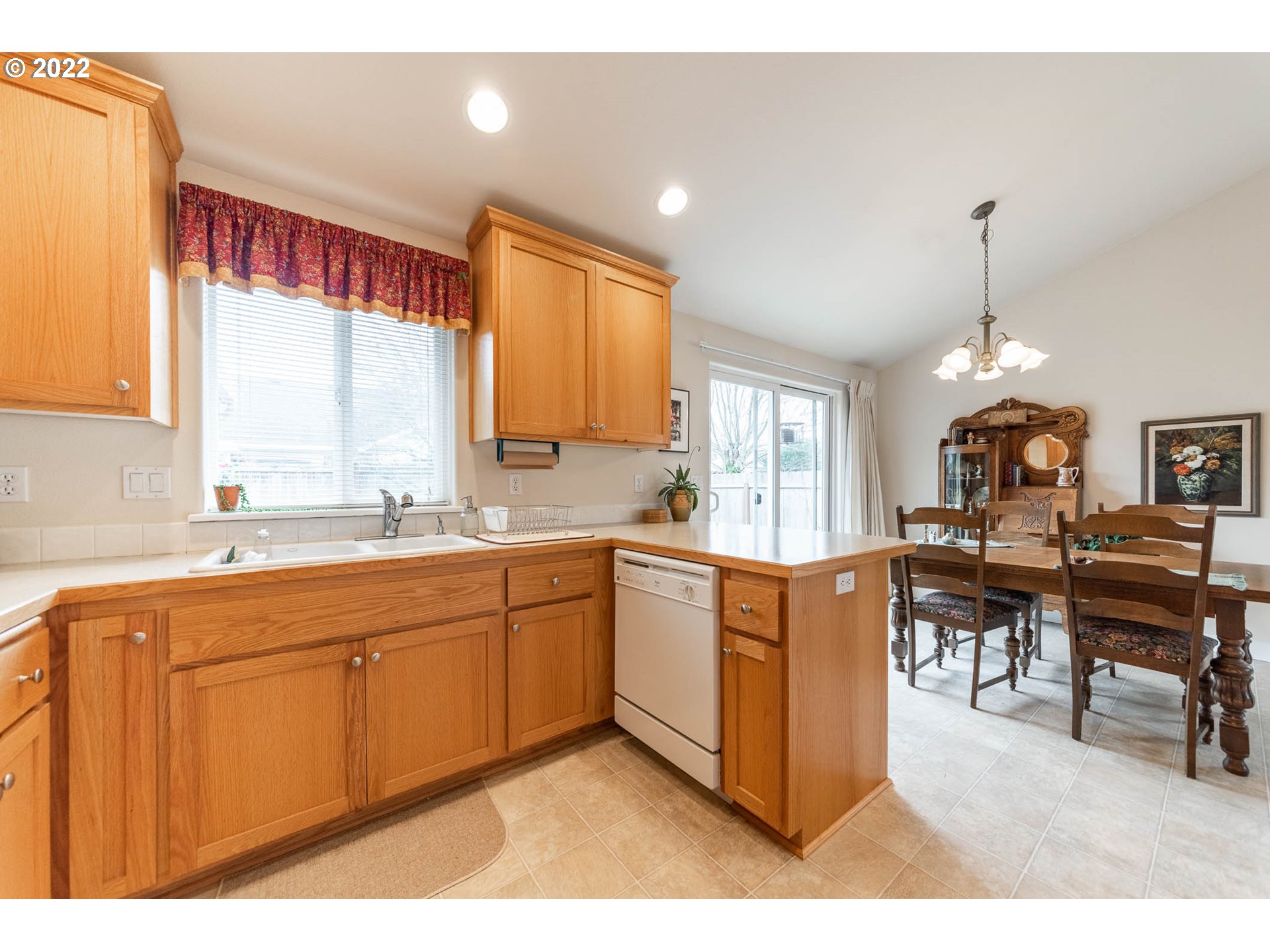 4019 Douglas Drive Springfield, OR 97478 - Photo 10 of 32 a large kitchen with kitchen island granite countertop a sink cabinets and window