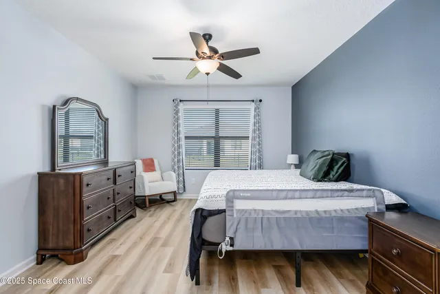 a view of storage and utility room with washer and dryer