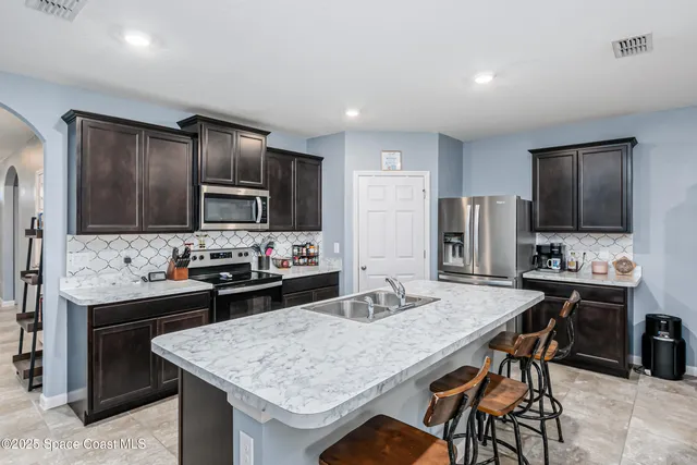a bathroom with a sink mirror and double vanity