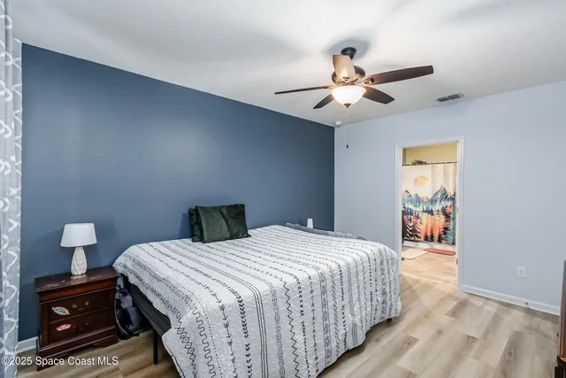 a bed room with a bed and a window