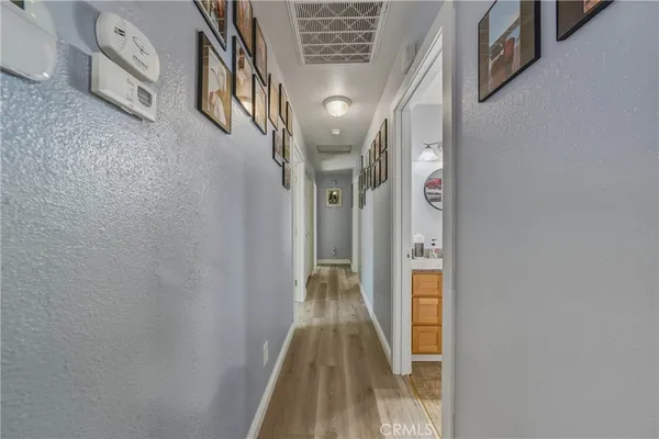 a view of gallery with wooden floor