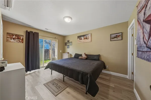 a bed sitting in a bedroom next to a window