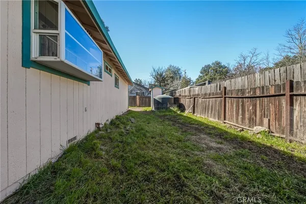 a view of backyard with green space