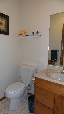 4891 Alii Road Hanapepe, HI 96716 - Photo 12 of 25 a bathroom with a toilet and a mirror