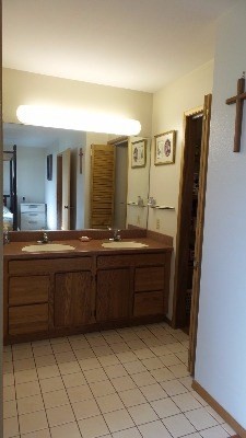 4891 Alii Road Hanapepe, HI 96716 - Photo 18 of 25 a bathroom with a granite countertop sink and a mirror