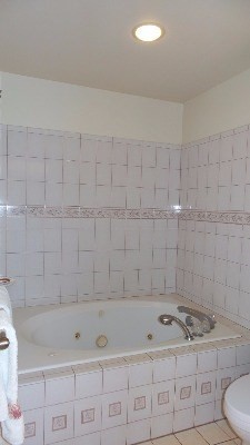 4891 Alii Road Hanapepe, HI 96716 - Photo 19 of 25 a bathroom with a sink a toilet and vanity
