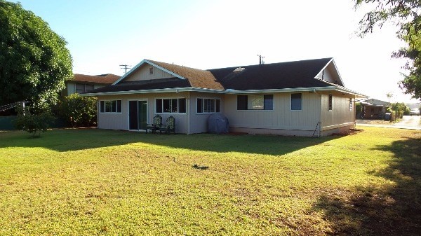 4891 Alii Road Hanapepe, HI 96716 - Photo 24 of 25 a front view of a house with a yard