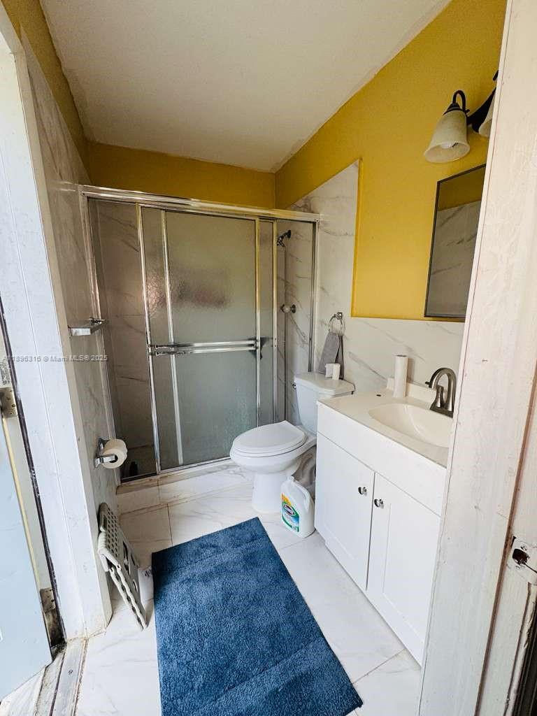 3405 Northwest 82nd Avenue Coral Springs, FL 33065 - Photo 14 of 26 a bathroom with a sink a toilet and shower