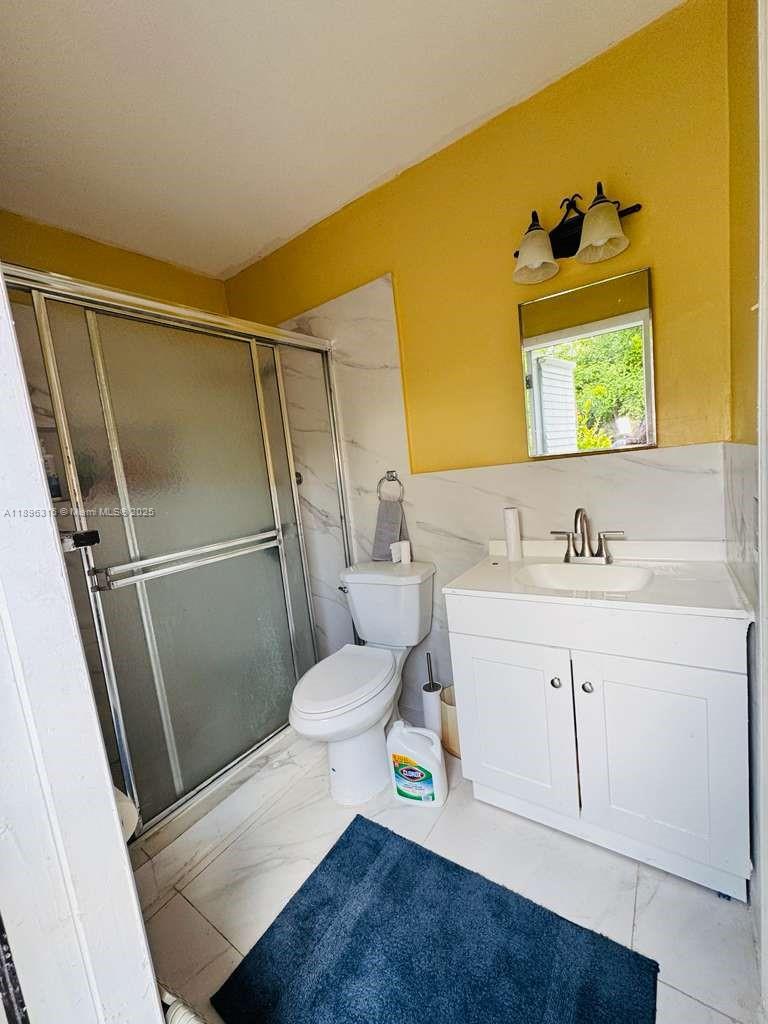 3405 Northwest 82nd Avenue Coral Springs, FL 33065 - Photo 15 of 26 a bathroom with a sink mirror vanity and toilet