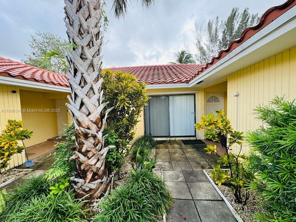 3405 Northwest 82nd Avenue Coral Springs, FL 33065 - Photo 3 of 26 a view of a pathway with a house
