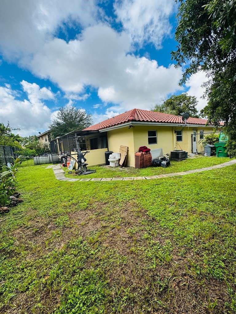 3405 Northwest 82nd Avenue Coral Springs, FL 33065 - Photo 6 of 26 a view of a house with a yard