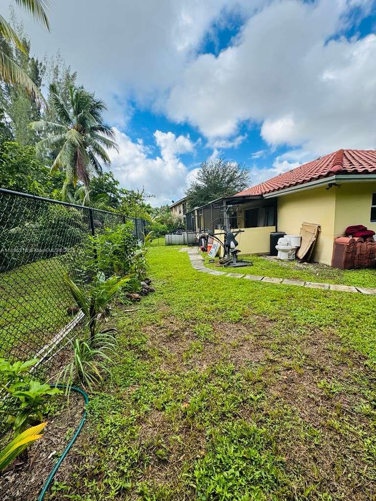 3405 Northwest 82nd Avenue Coral Springs, FL 33065 - Photo 7 of 26 a view of a house with yard and sitting area