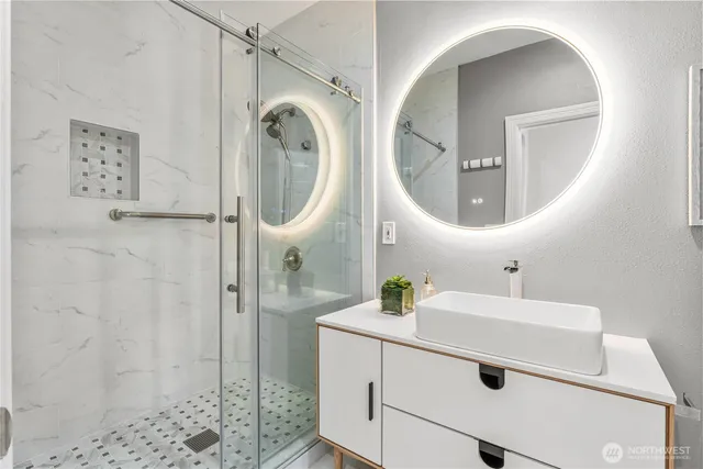 a bathroom with a sink and a mirror