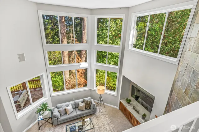 a living room with furniture and a flat tv screen