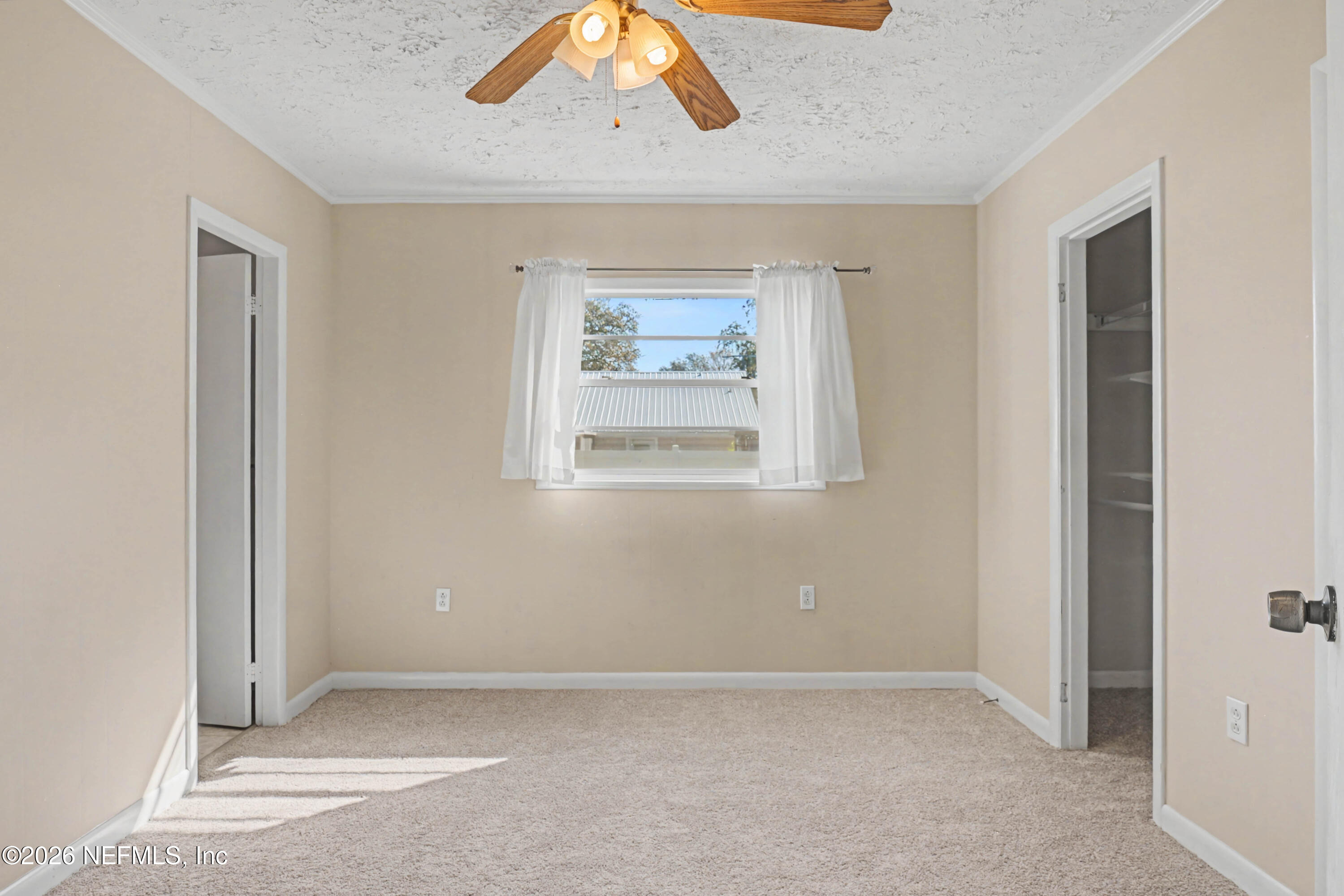 215 Orchis Road St. Augustine, FL 32086 - Photo 15 of 51 an empty room with windows