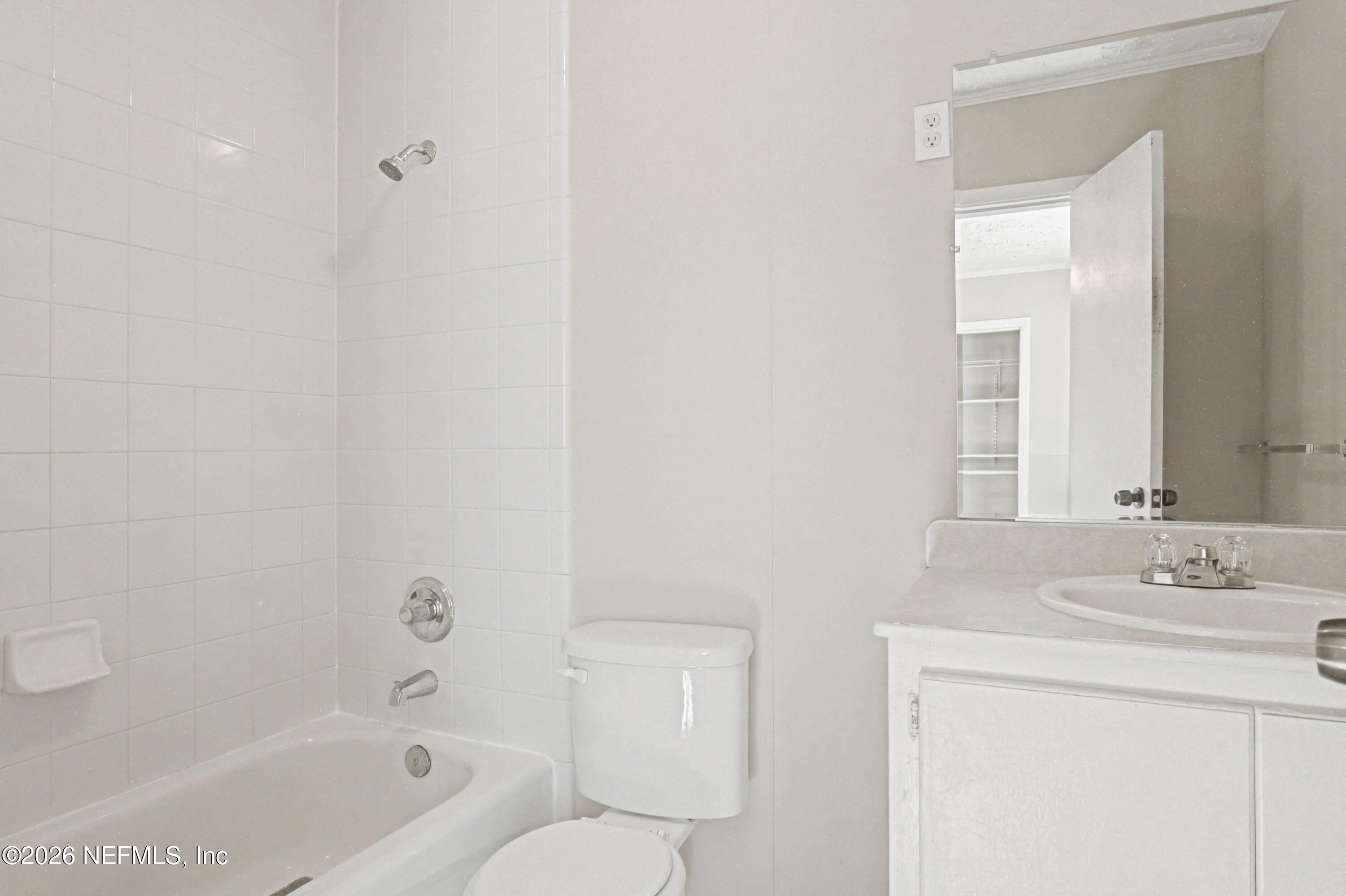 215 Orchis Road St. Augustine, FL 32086 - Photo 17 of 51 a bathroom with a sink a toilet and shower